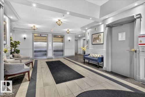 Common area featuring a decorative wall and wainscoting - 402 10649 Saskatchewan Drive, Edmonton, AB - Indoor Photo Showing Other Room
