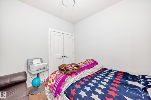 Bedroom featuring wood finished floors and a closet - 17112 68 Street, Edmonton, AB - Indoor Photo Showing Bedroom