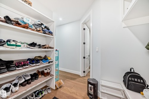 Walk in closet with light wood-type flooring - 17112 68 Street, Edmonton, AB - Indoor