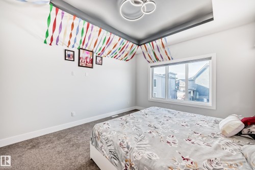 Bedroom featuring baseboards and carpet flooring - 17112 68 Street, Edmonton, AB - Indoor Photo Showing Bedroom