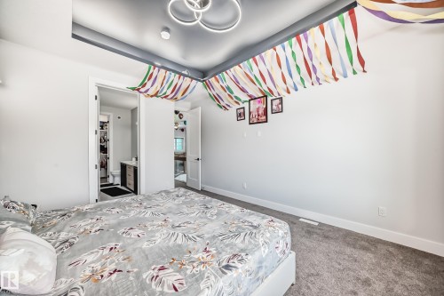 Bedroom featuring carpet flooring and baseboards - 17112 68 Street, Edmonton, AB - Indoor Photo Showing Bedroom