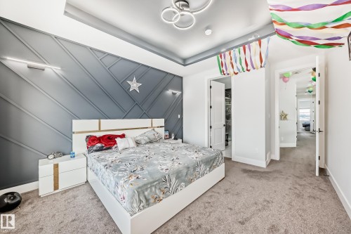 Bedroom featuring carpet flooring and baseboards - 17112 68 Street, Edmonton, AB - Indoor Photo Showing Bedroom