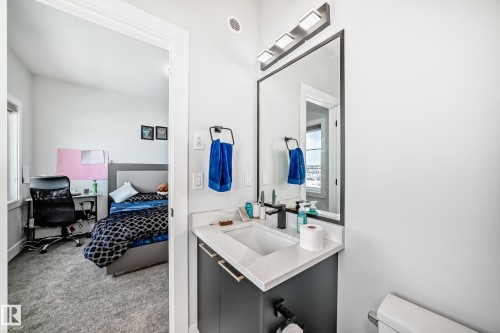 Bathroom with light colored carpet and vanity - 17112 68 Street, Edmonton, AB - Indoor Photo Showing Bathroom
