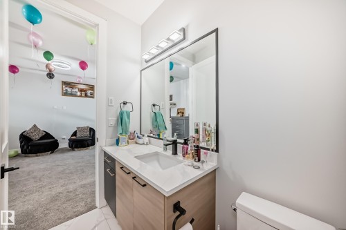 Half bathroom featuring vanity and light carpet - 17112 68 Street, Edmonton, AB - Indoor Photo Showing Bathroom