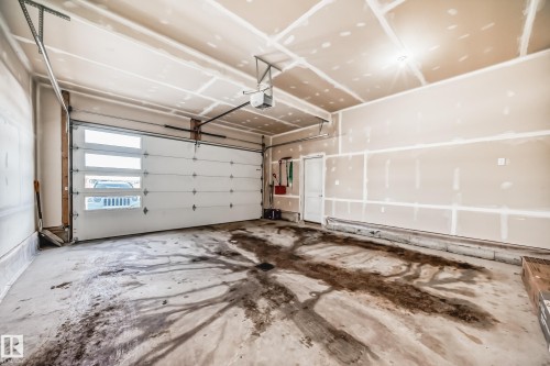 Garage featuring a garage door opener - 17112 68 Street, Edmonton, AB - Indoor Photo Showing Garage