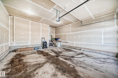 Garage featuring a garage door opener - 17112 68 Street, Edmonton, AB - Indoor Photo Showing Garage