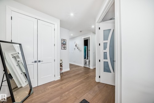 Corridor featuring light wood-style floors and recessed lighting - 17112 68 Street, Edmonton, AB - Indoor Photo Showing Other Room