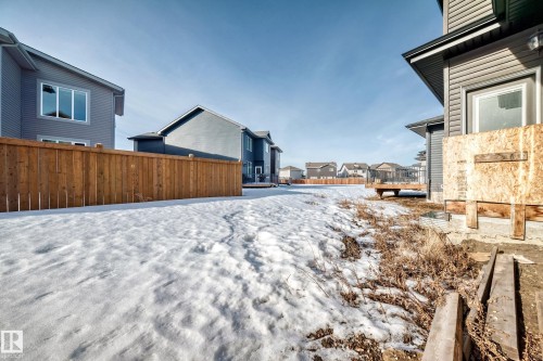 Yard covered in snow featuring a residential view - 17112 68 Street, Edmonton, AB - Outdoor
