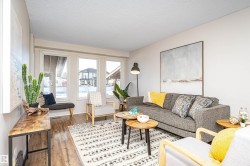 Living area featuring a textured ceiling and hardwood / wood-style flooring - 