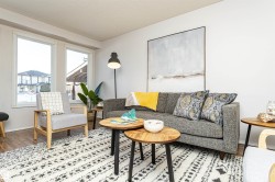 Living room featuring a textured ceiling and wood finished floors - 