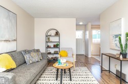 Living area featuring a textured ceiling and wood finished floors - 
