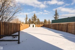 Fenced backyard with a shed - 