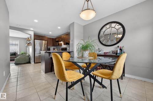 Dining area with recessed lighting and light tile patterned flooring - 5256 21 Avenue, Edmonton, AB - Indoor Photo Showing Dining Room