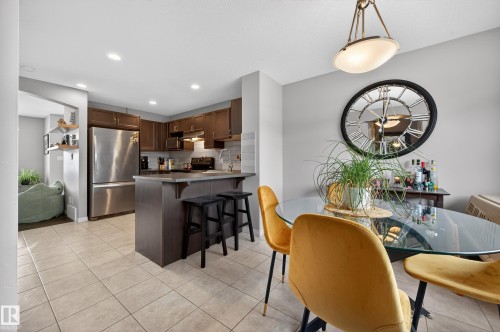 Dining area with light tile patterned flooring and recessed lighting - 5256 21 Avenue, Edmonton, AB - Indoor