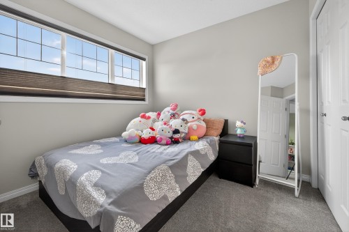 Bedroom featuring carpet flooring - 5256 21 Avenue, Edmonton, AB - Indoor Photo Showing Bedroom