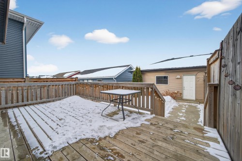 Snow covered deck with a fenced backyard - 5256 21 Avenue, Edmonton, AB - Outdoor With Deck Patio Veranda With Exterior