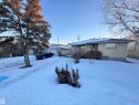 View of front facade with stucco siding, an outbuilding, and a garage - 10407 102 Street, Westlock, AB  - Outdoor 