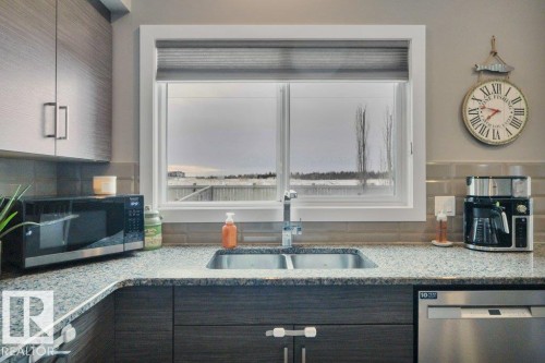 45 Sandalwood Place, Leduc, AB - Indoor Photo Showing Kitchen With Double Sink