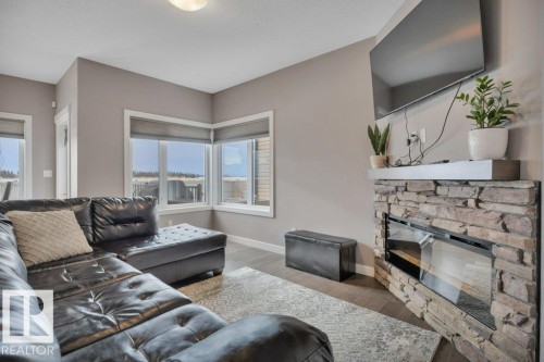 45 Sandalwood Place, Leduc, AB - Indoor Photo Showing Living Room With Fireplace