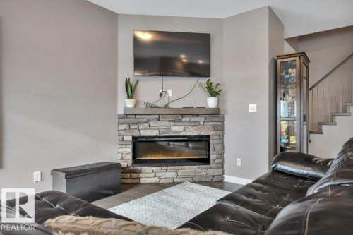 45 Sandalwood Place, Leduc, AB - Indoor Photo Showing Living Room With Fireplace