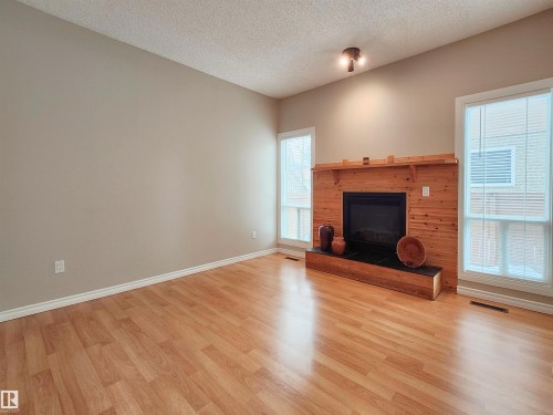 69 3812 20 Avenue, Edmonton, AB - Indoor Photo Showing Living Room With Fireplace