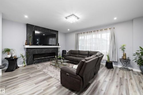 4223 Veterans Way, Edmonton, AB - Indoor Photo Showing Living Room With Fireplace