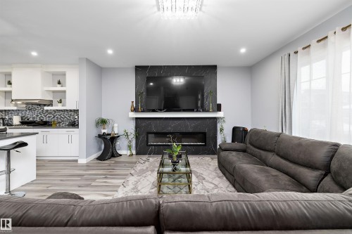4223 Veterans Way, Edmonton, AB - Indoor Photo Showing Living Room With Fireplace