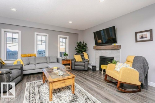 49 Wilson Close, Fort Saskatchewan, AB - Indoor Photo Showing Living Room With Fireplace