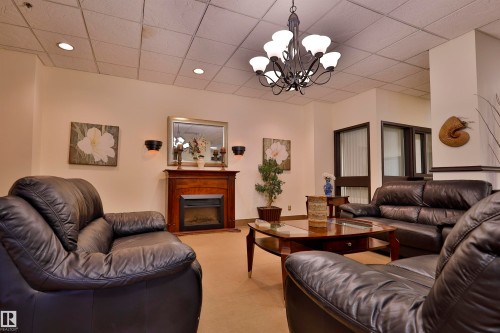 401 10149 Saskatchewan Drive, Edmonton, AB - Indoor Photo Showing Living Room With Fireplace