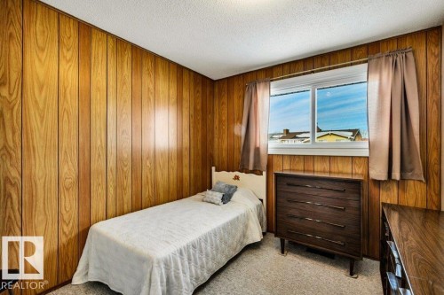 Bedroom with light colored carpet and a textured ceiling - 8919 152A Avenue, Edmonton, AB - Indoor Photo Showing Bedroom