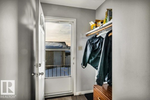 Walk in closet featuring dark wood-style floors - 8919 152A Avenue, Edmonton, AB - Indoor