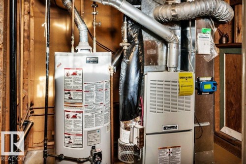 Utilities with water heater and heating unit - 8919 152A Avenue, Edmonton, AB - Indoor Photo Showing Basement