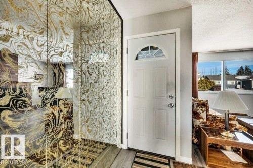 Entryway with wood finished floors and a textured ceiling - 8919 152A Avenue, Edmonton, AB - Indoor Photo Showing Other Room