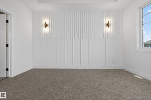 Unfurnished room with dark colored carpet and baseboards - 26 Rosa Crescent, St. Albert, AB - Indoor Photo Showing Other Room