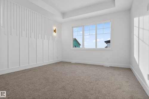 Spare room featuring light colored carpet and a tray ceiling - 26 Rosa Crescent, St. Albert, AB - Indoor Photo Showing Other Room