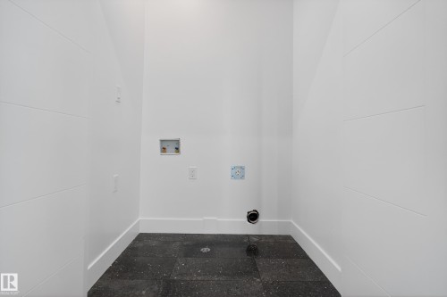 Laundry room with hookup for a washing machine and baseboards - 26 Rosa Crescent, St. Albert, AB - Indoor Photo Showing Other Room