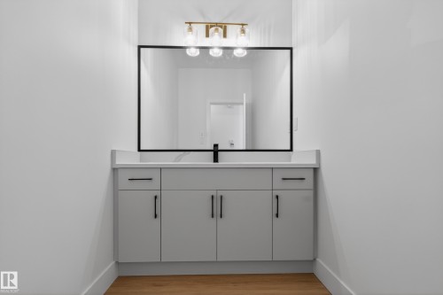 Bathroom featuring vanity and light wood-style floors - 26 Rosa Crescent, St. Albert, AB - Indoor