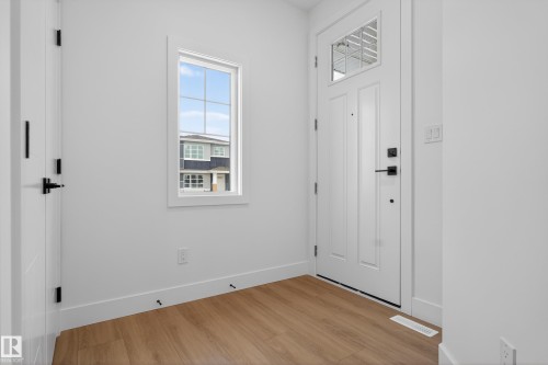 Entrance foyer featuring baseboards and light wood-style floors - 26 Rosa Crescent, St. Albert, AB - Indoor Photo Showing Other Room
