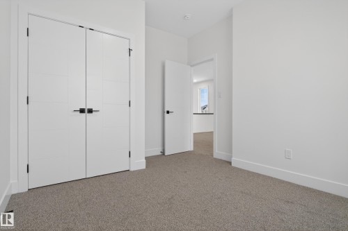 Unfurnished bedroom featuring carpet floors and a closet - 26 Rosa Crescent, St. Albert, AB - Indoor Photo Showing Other Room