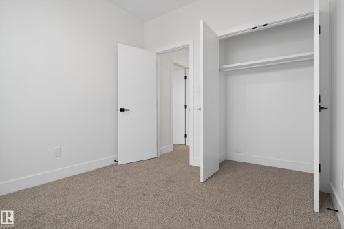 Unfurnished bedroom with light carpet and a closet - 26 Rosa Crescent, St. Albert, AB - Indoor Photo Showing Other Room