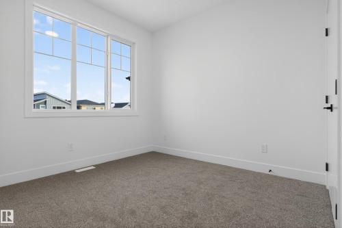 Carpeted spare room with baseboards - 26 Rosa Crescent, St. Albert, AB - Indoor Photo Showing Other Room