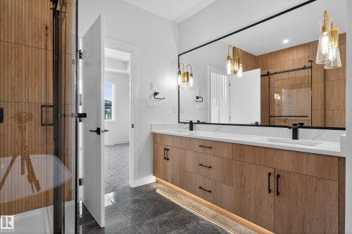 Bathroom featuring granite tiled floors, an enclosed shower, and double vanity - 26 Rosa Crescent, St. Albert, AB - Indoor Photo Showing Bathroom