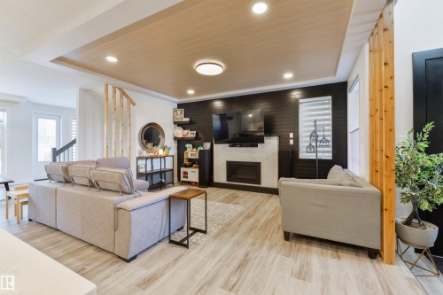 219 37 Street, Edmonton, AB - Indoor Photo Showing Living Room With Fireplace