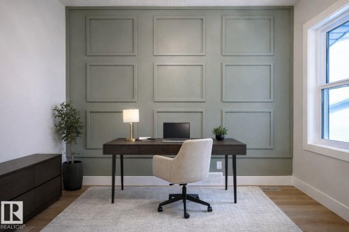 Office area with light wood-style flooring and a decorative wall - 16 Middleton Close, Leduc, AB - Indoor Photo Showing Office