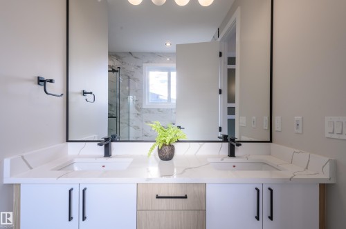 Full bathroom featuring a marble finish shower and double vanity - 16 Middleton Close, Leduc, AB - Indoor Photo Showing Bathroom