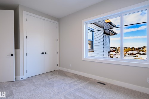 Unfurnished bedroom with a closet and light carpet - 16 Middleton Close, Leduc, AB - Indoor Photo Showing Other Room