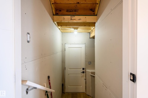 Corridor with wood finished floors - 16 Middleton Close, Leduc, AB - Indoor