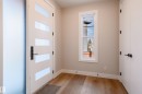 Doorway to outside featuring wood finished floors and baseboards - 16 Middleton Close, Leduc, AB  - Indoor Photo Showing Other Room 