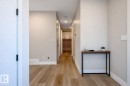 Hall with light wood-type flooring and baseboards - 16 Middleton Close, Leduc, AB  - Indoor Photo Showing Other Room 