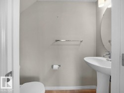 Half bathroom with baseboards and toilet - 